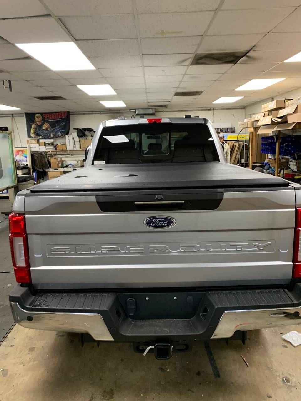 Truck bed with a tonneau cover, tool box, and fuel tank installed
