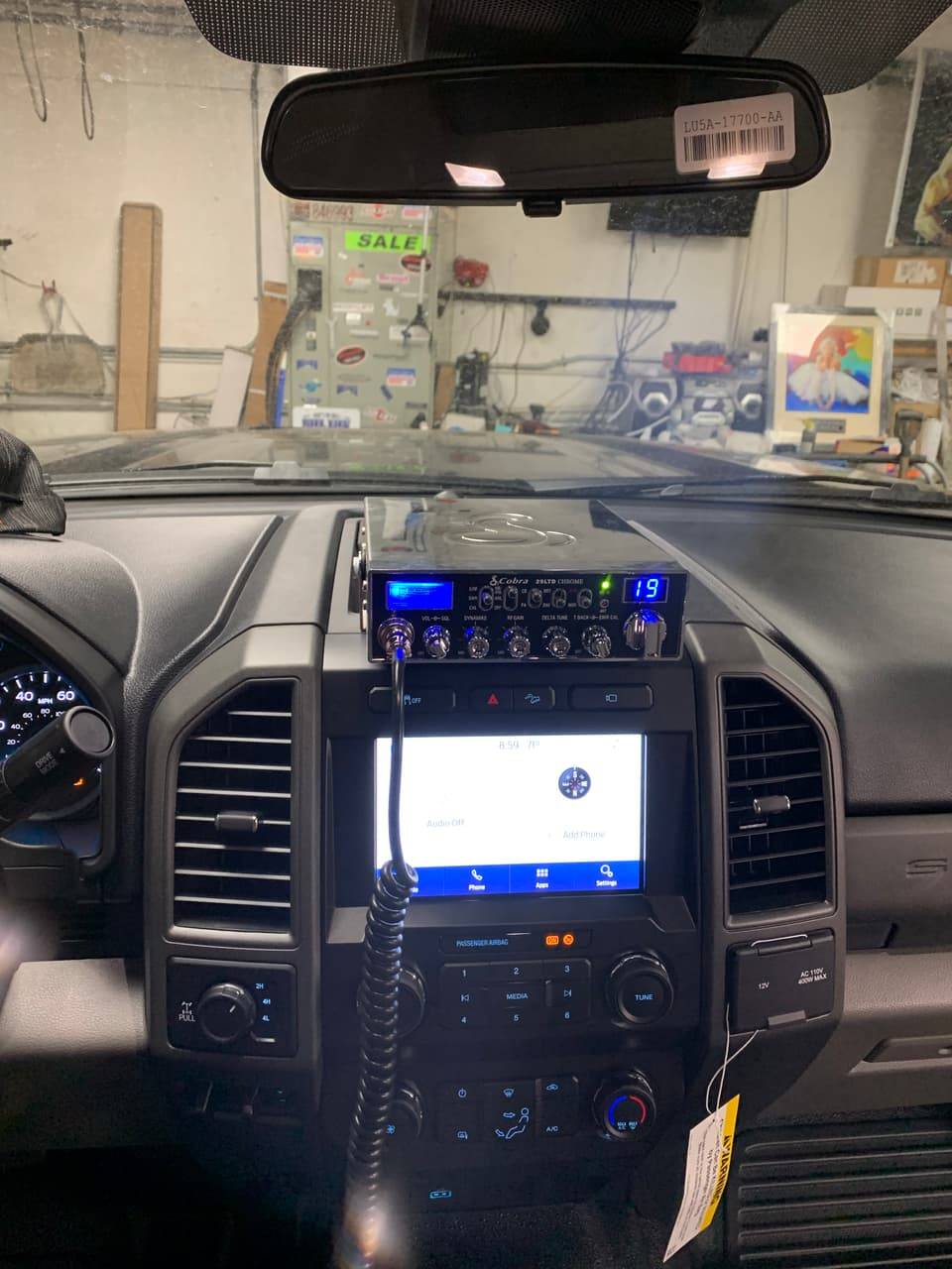 CB radio installed and wired into a truck dashboard