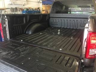 Close-up of a finished spray-in truck bed liner