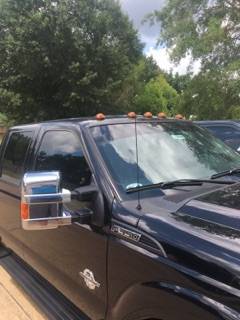 Amber cab roof lights installed on a work truck