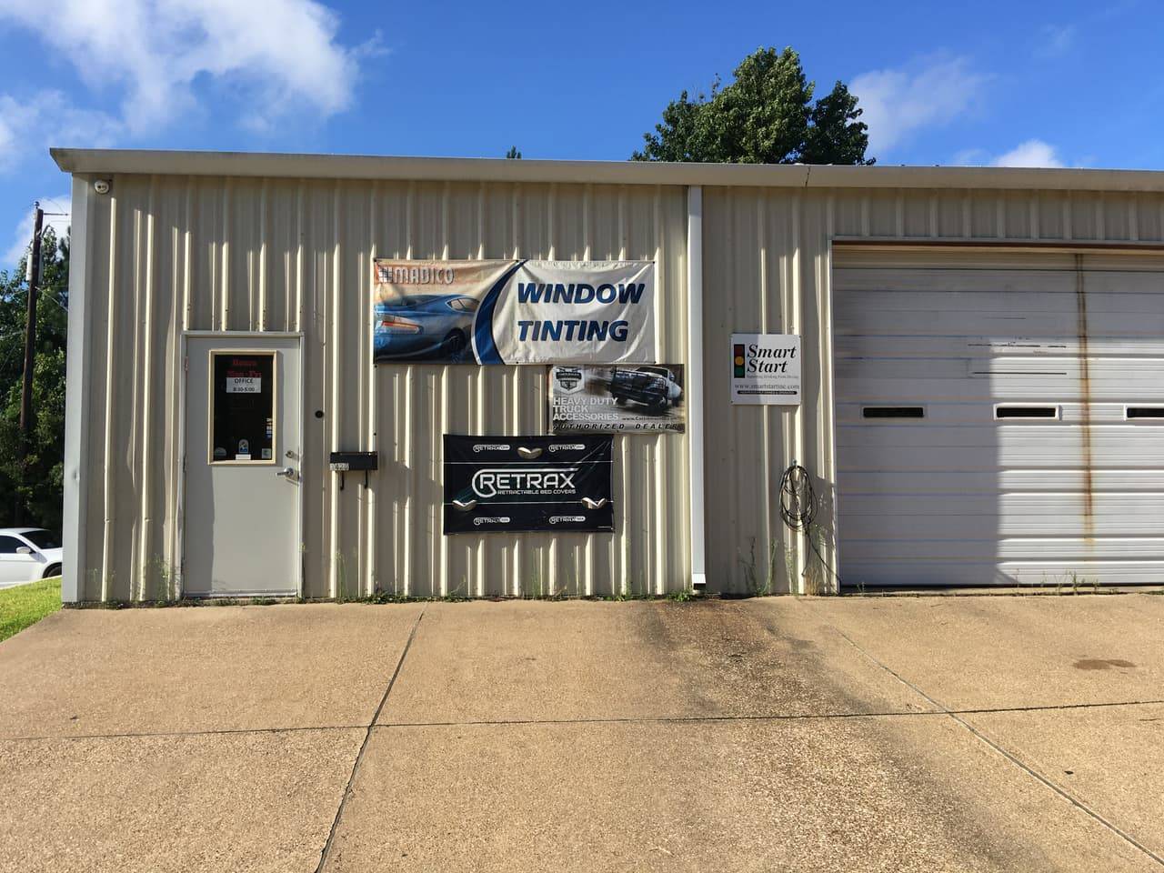Performance Tinters II shop entrance with window tinting and truck accessories signage
