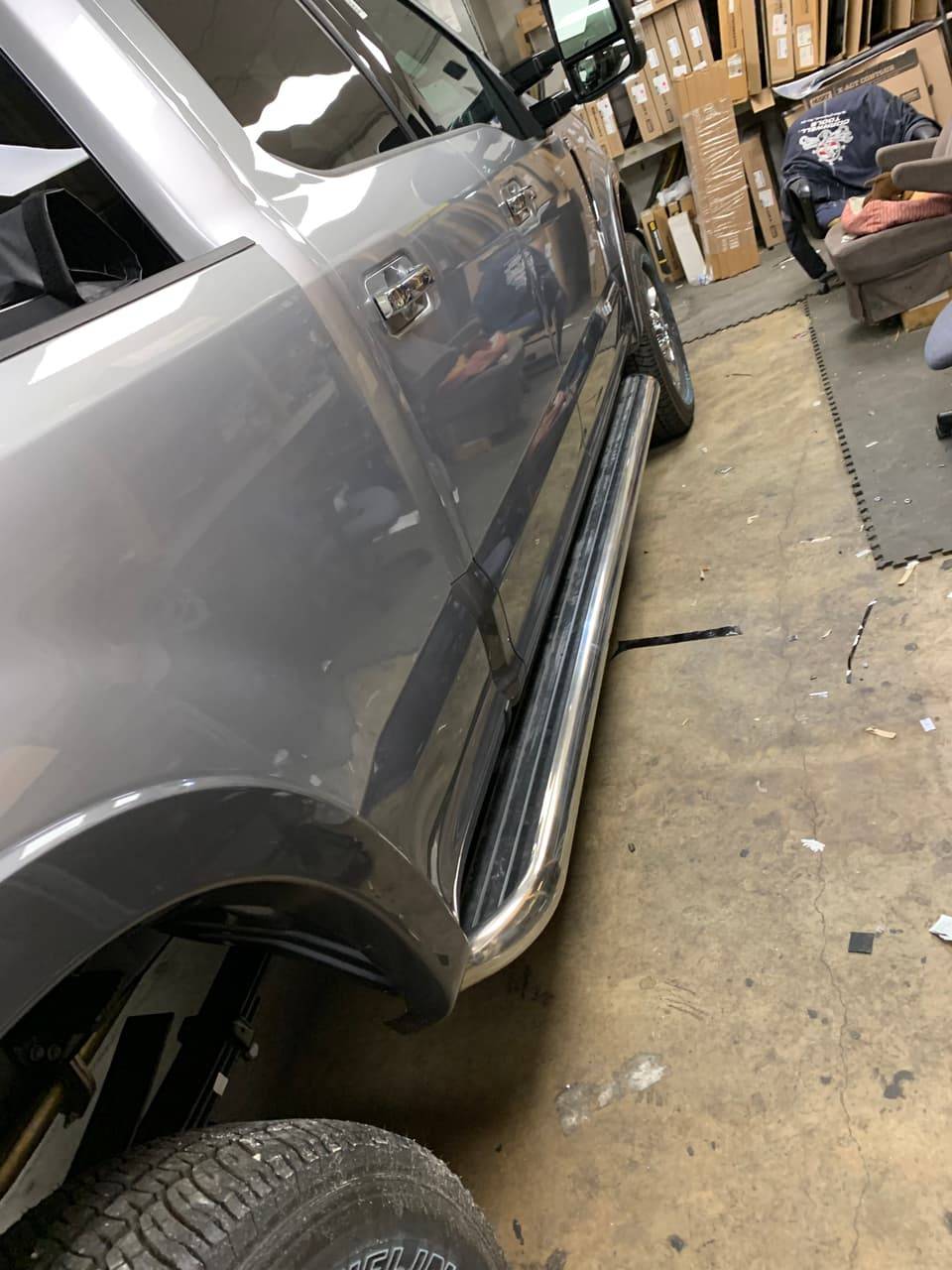 Chrome running board installed on a truck